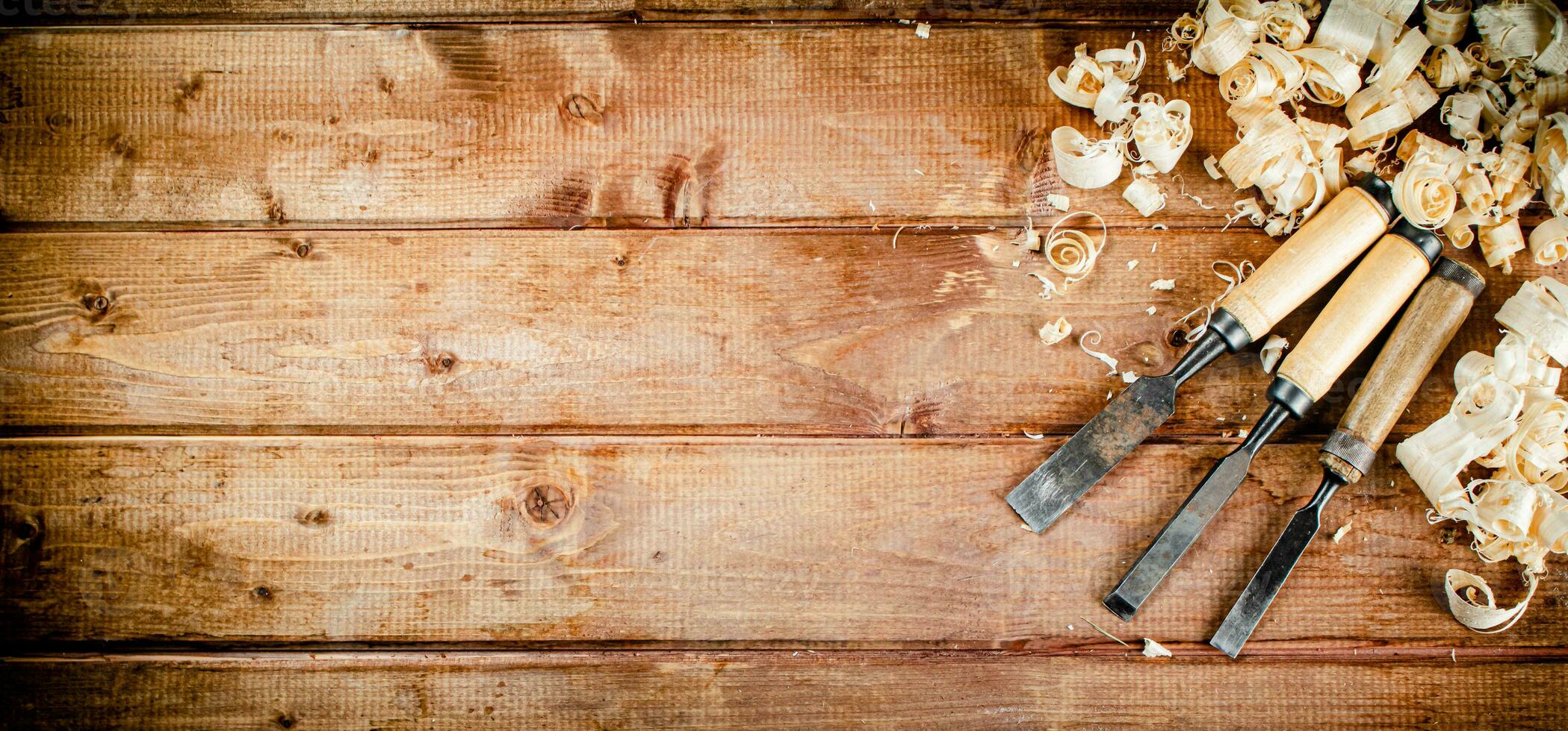 Chisel with a bunch of wood sawdust. photo