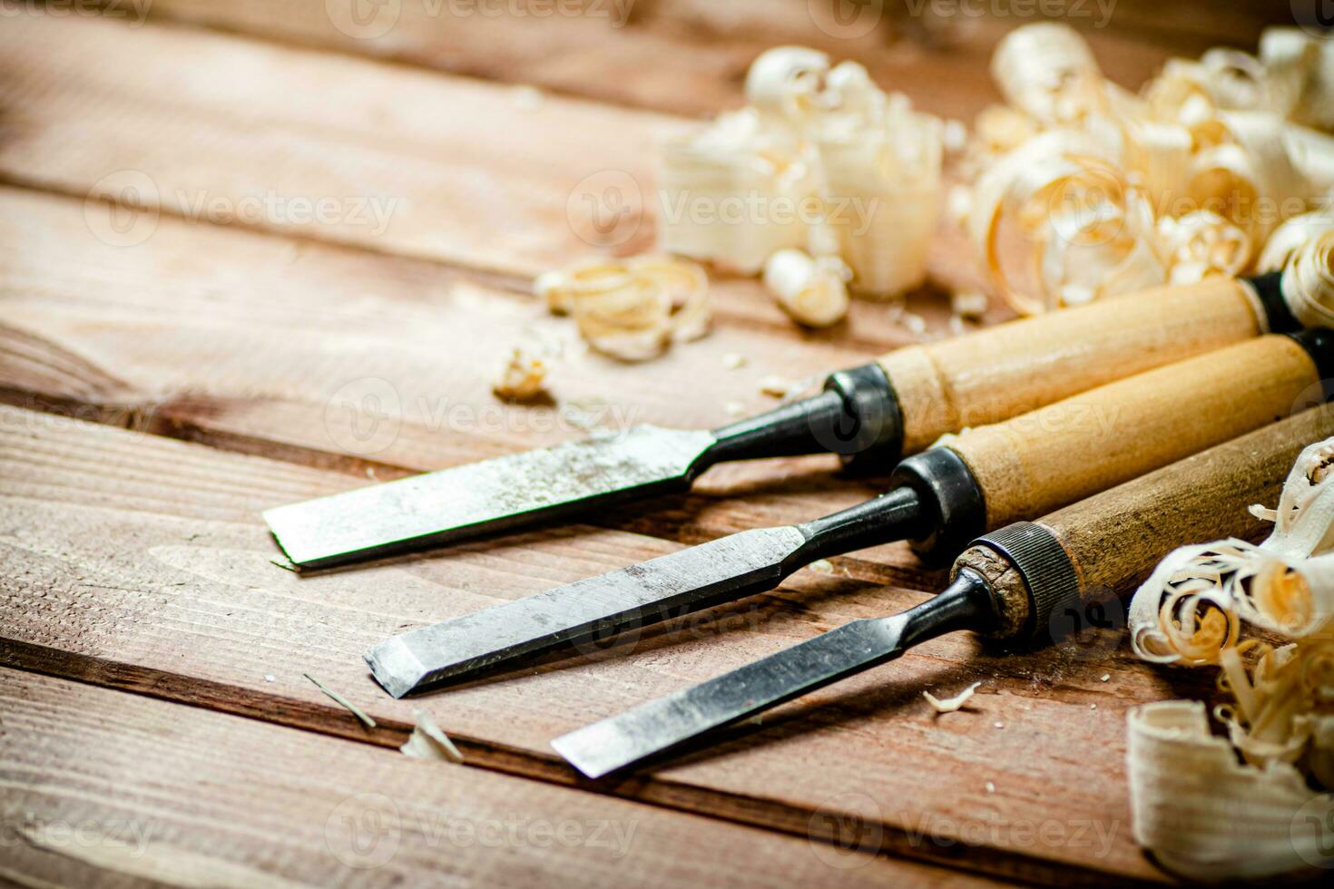 Chisel with a bunch of wood sawdust. photo