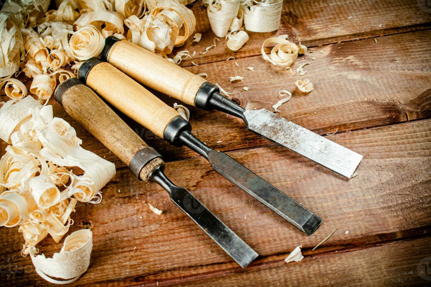 Chisel with a bunch of wood sawdust. photo