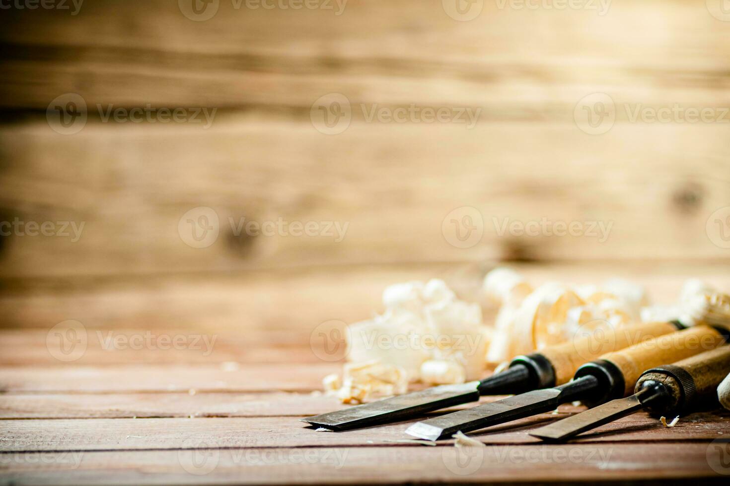 Chisel with a bunch of wood sawdust. photo