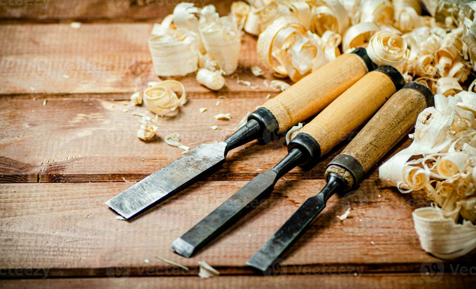 Chisel with a bunch of wood sawdust. photo