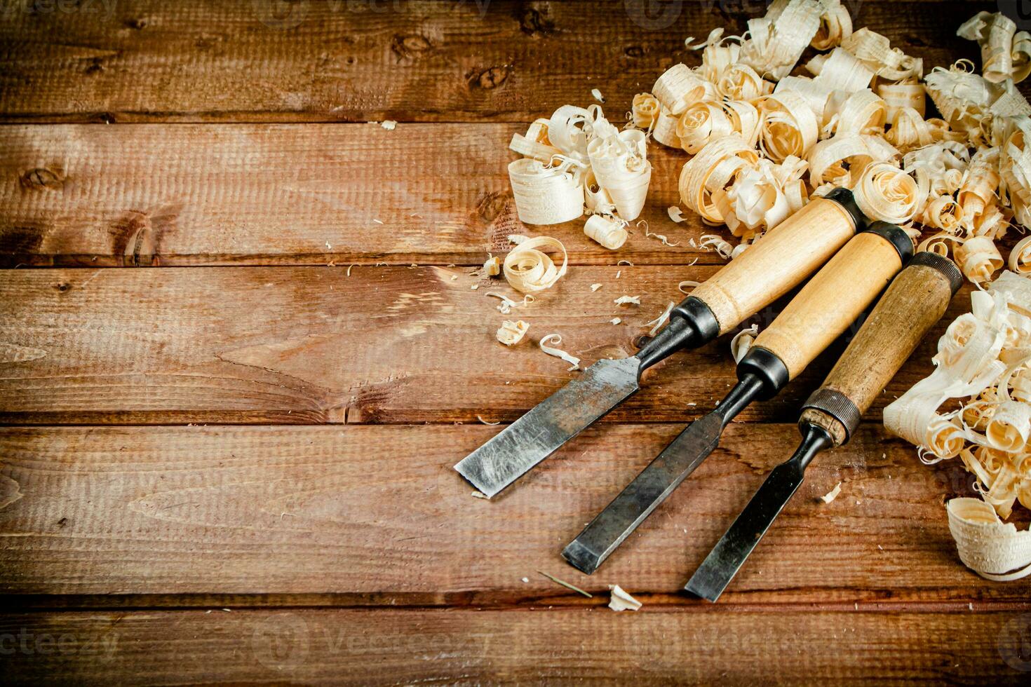 Chisel with a bunch of wood sawdust. photo