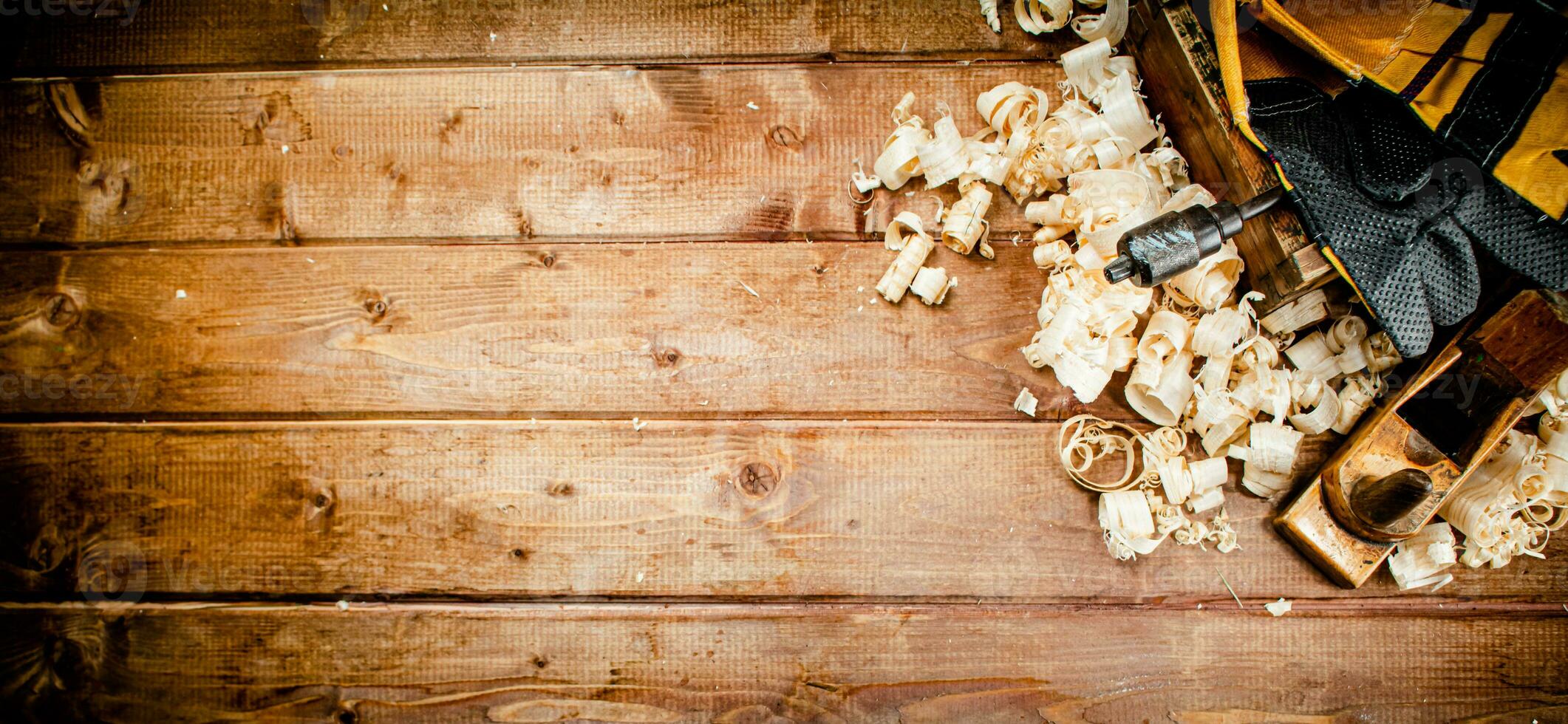 Hand planer with wooden sawdust. photo