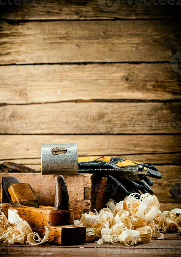 Hand planer with wooden sawdust. photo