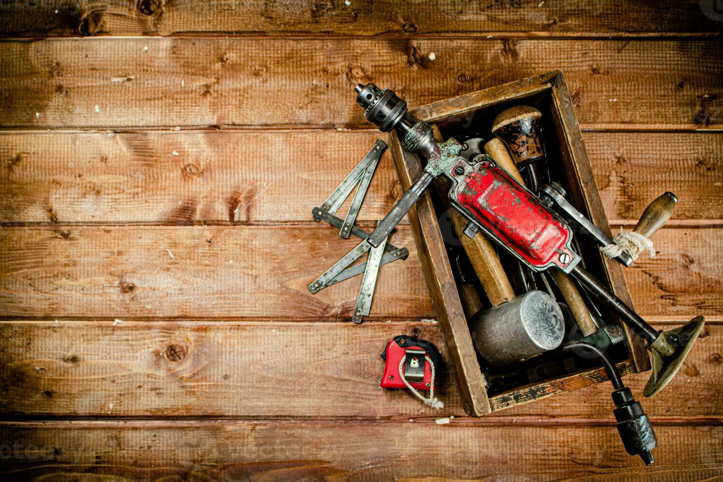 Hand drill with various drills. photo