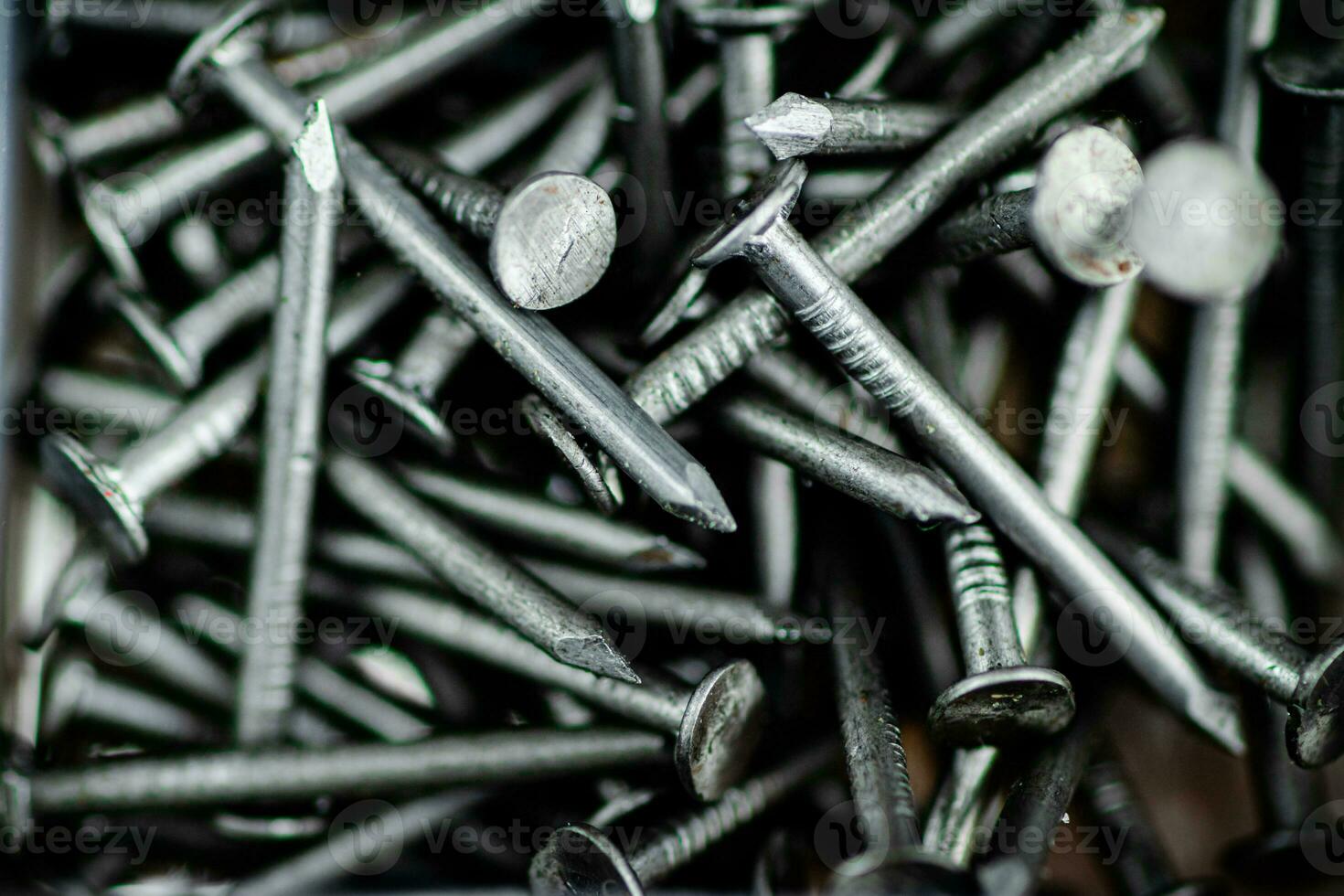A pile of bolts. Macro background. photo