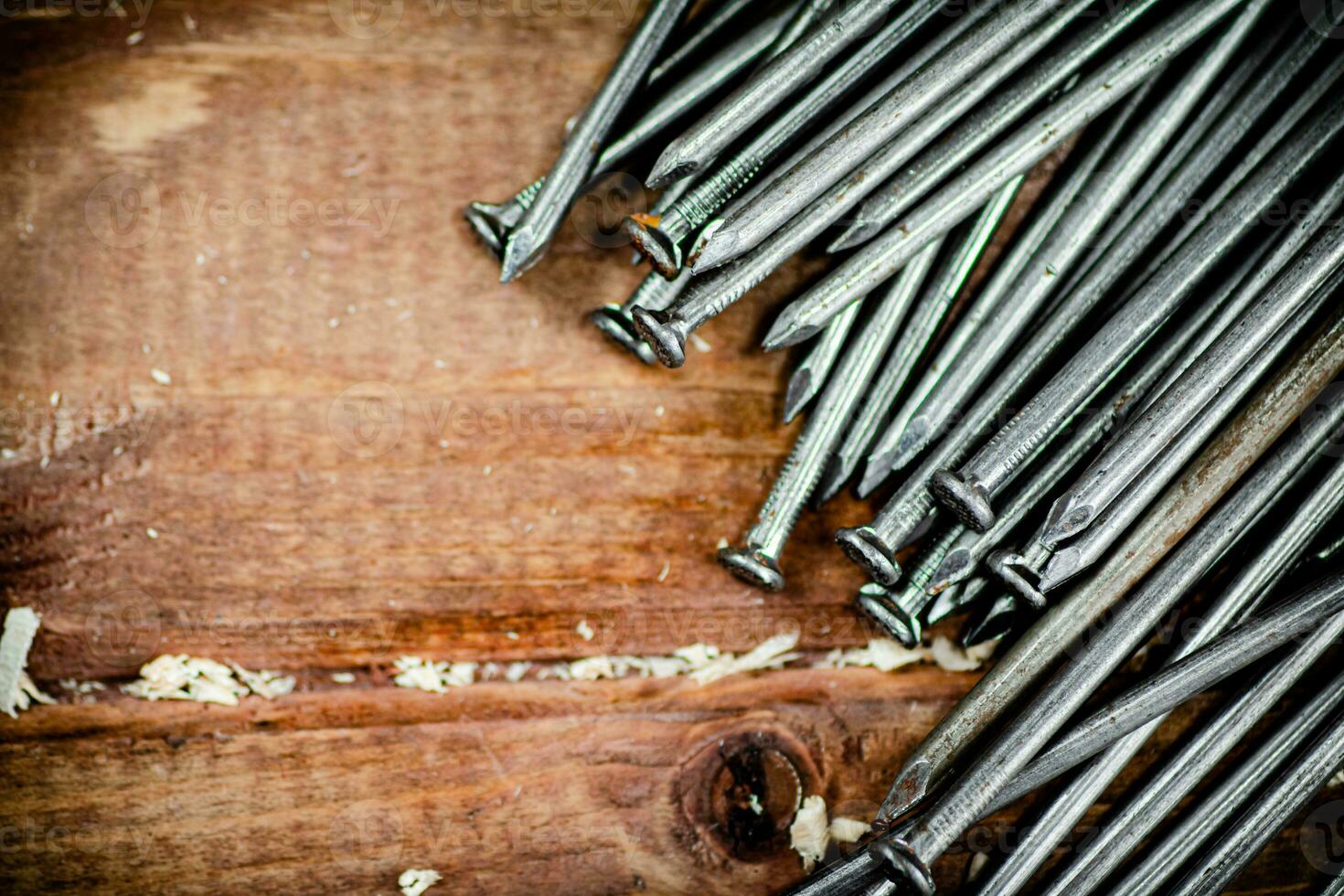 A bunch of nails on the table. photo