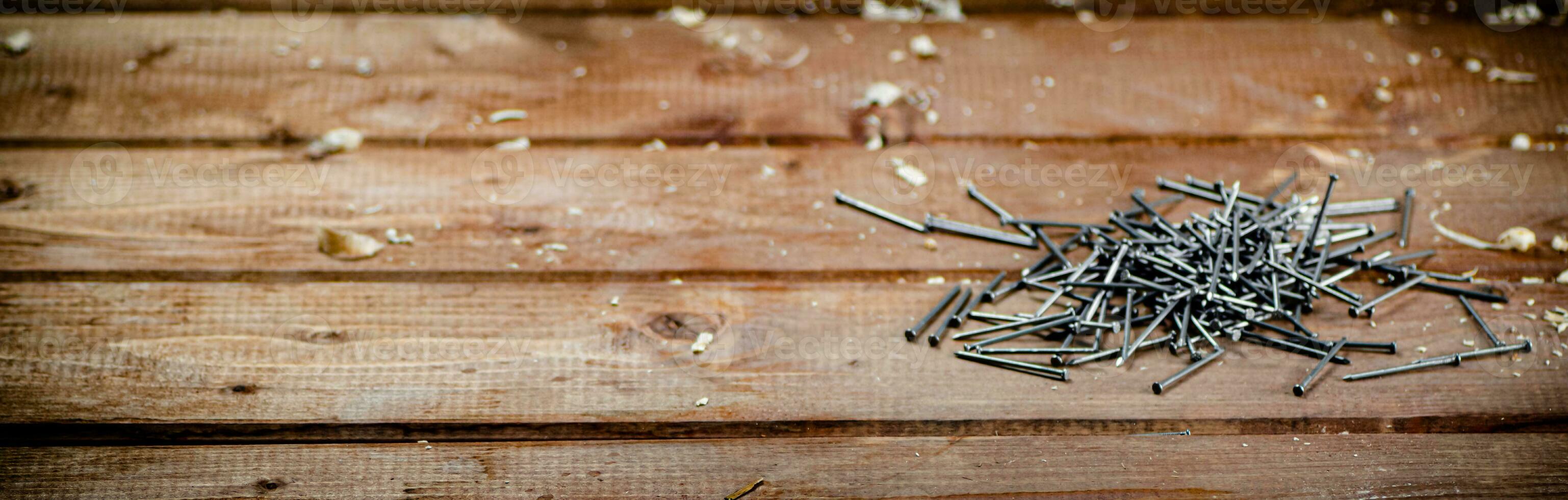A pile of nails on the table. photo