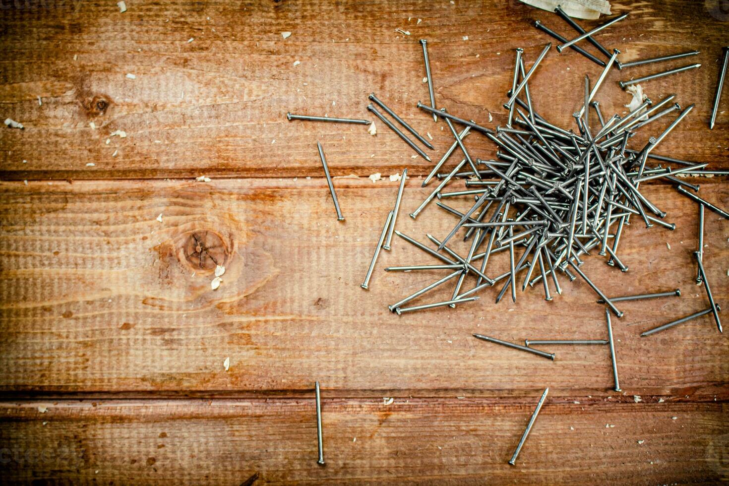 A pile of nails on the table. photo