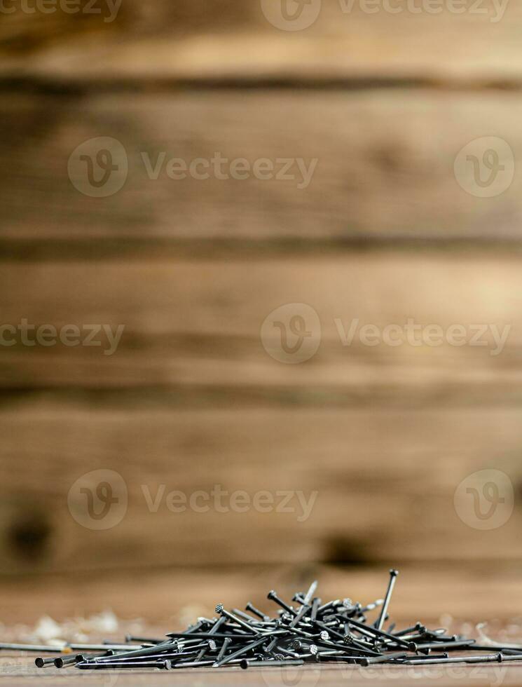 A pile of nails on the table. photo