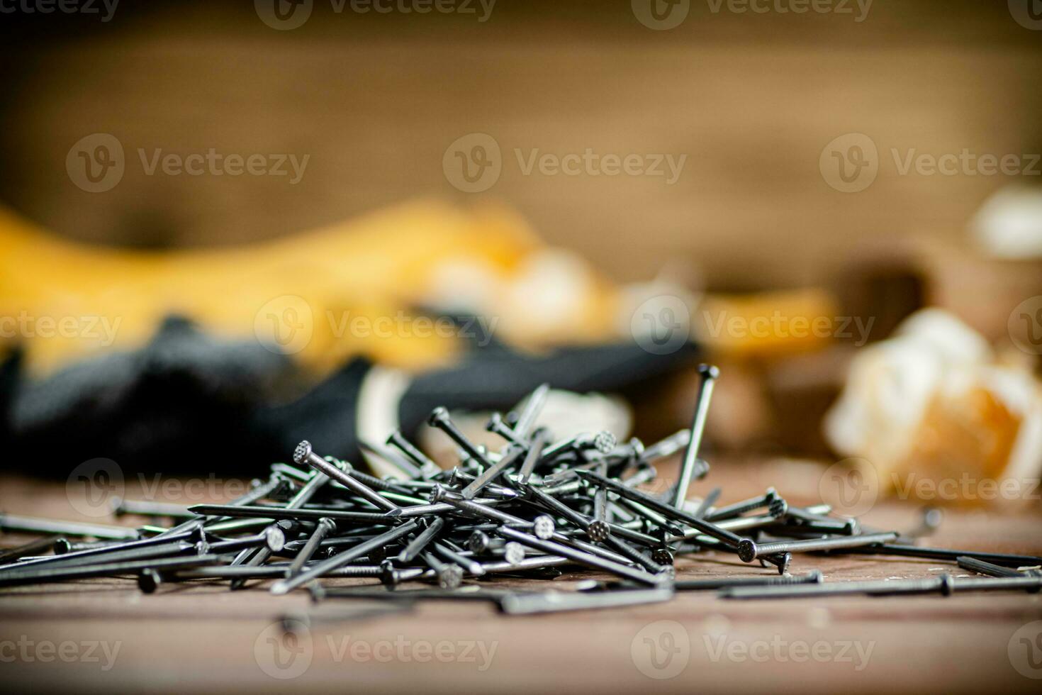 A pile of nails on the table. photo