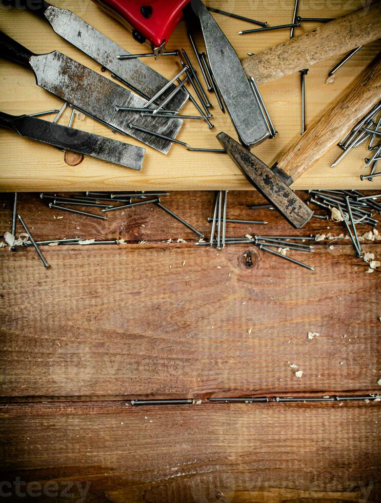 Working tool. Chisel, hammer and nails. photo