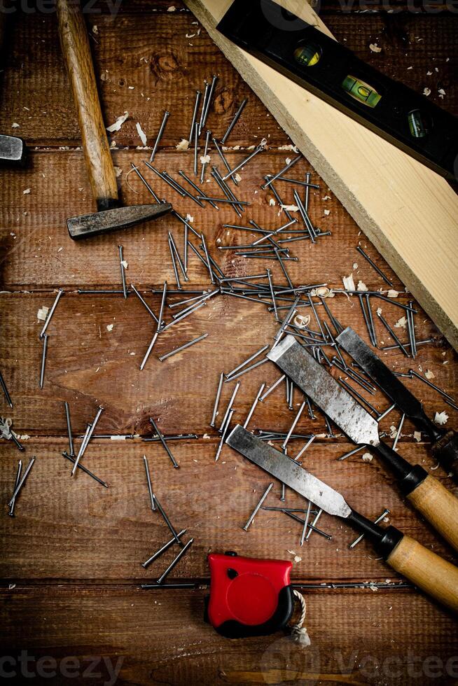 Working tool. Chisel, hammer and nails. photo