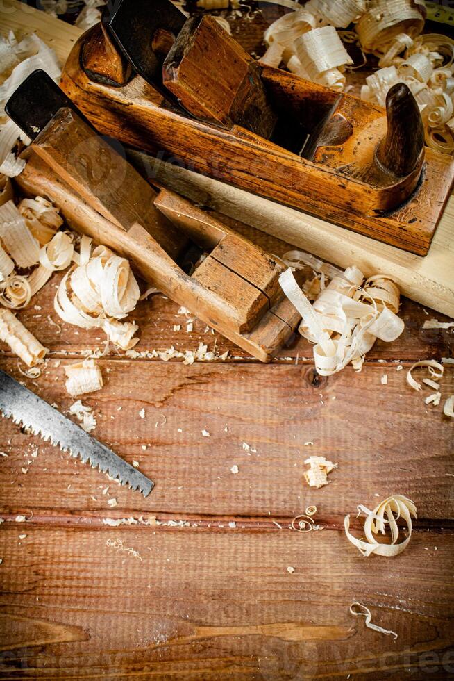 Working tool. Planer with wooden shavings. photo