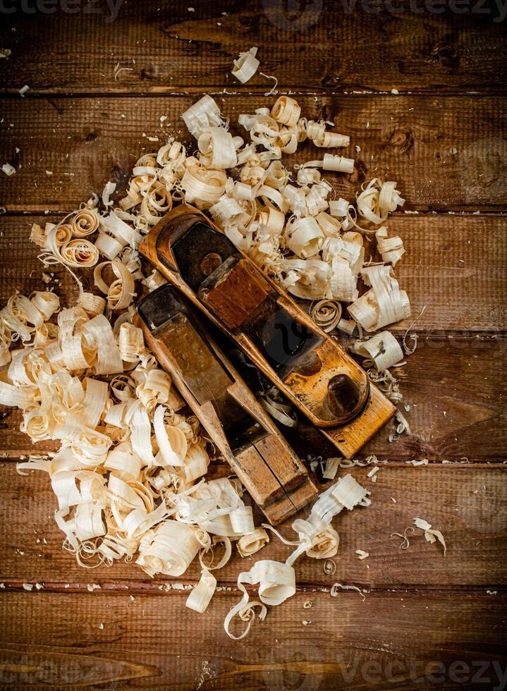 Working tool. Planer with wooden shavings. photo