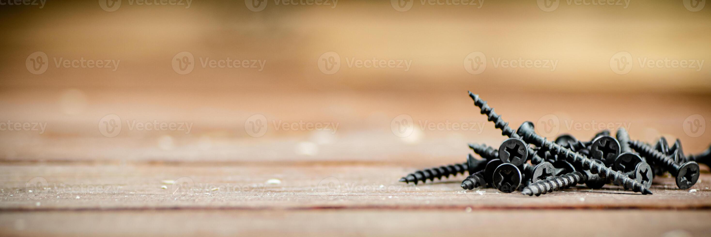 Self-tapping screws on the table. photo