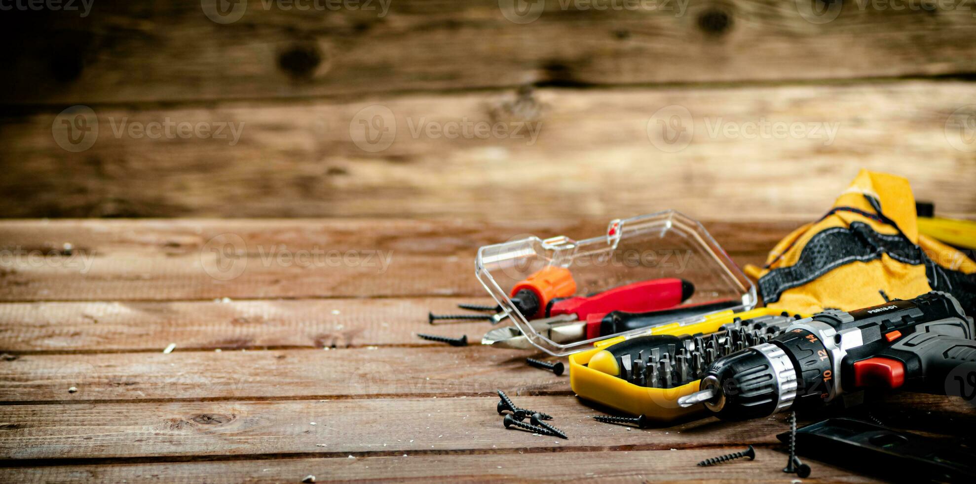 Working tool. Screwdriver with self-tapping screws on the table. photo