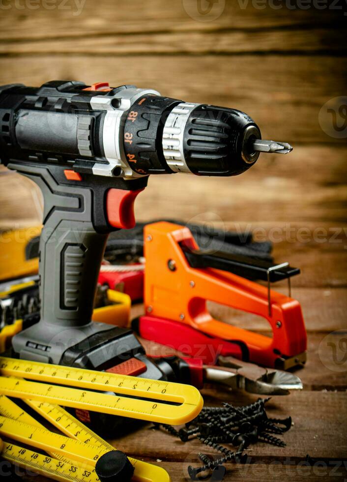 Working tool. Screwdriver with self-tapping screws on the table. photo