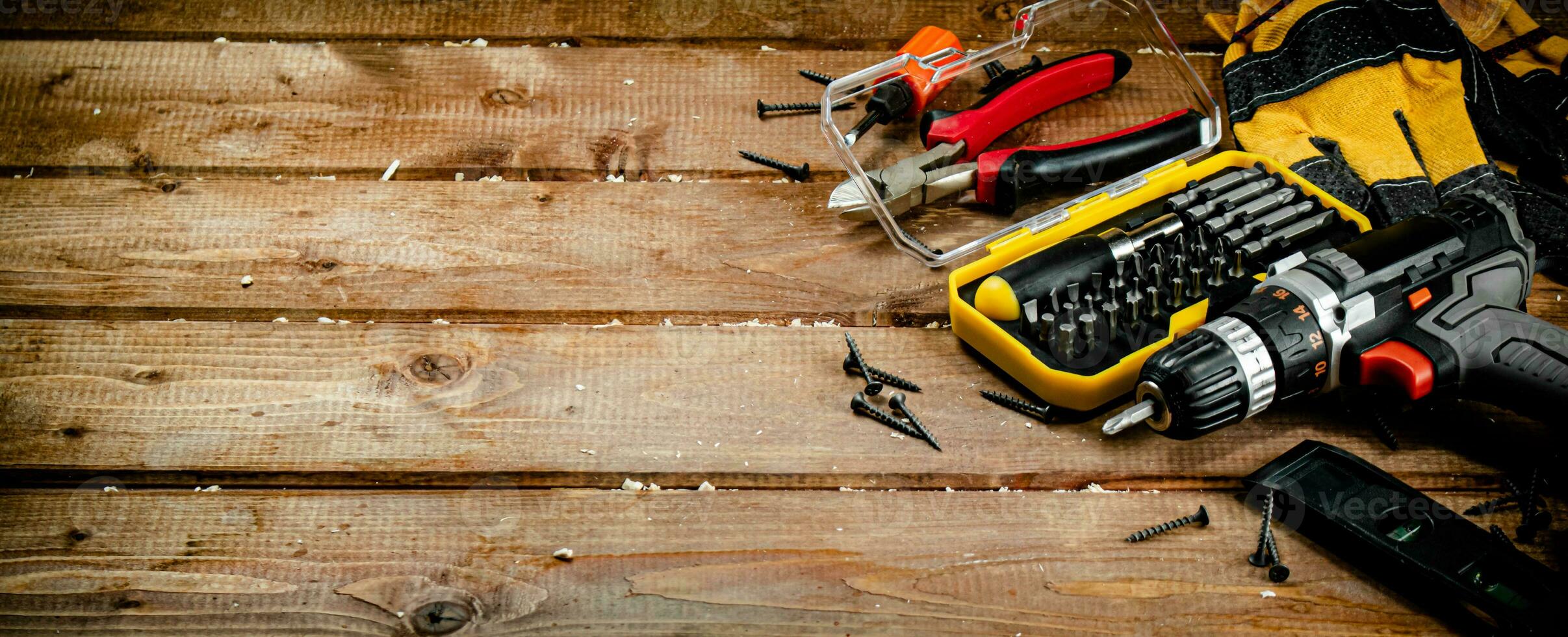 Working tool. Screwdriver with self-tapping screws on the table. photo