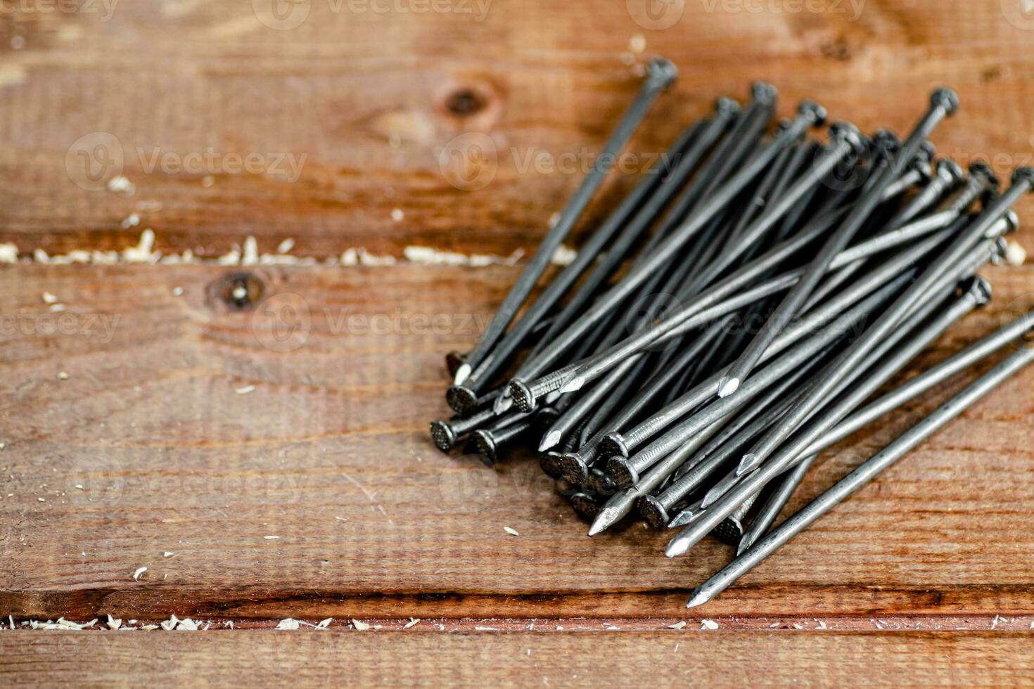 A pile of nails on the table. photo