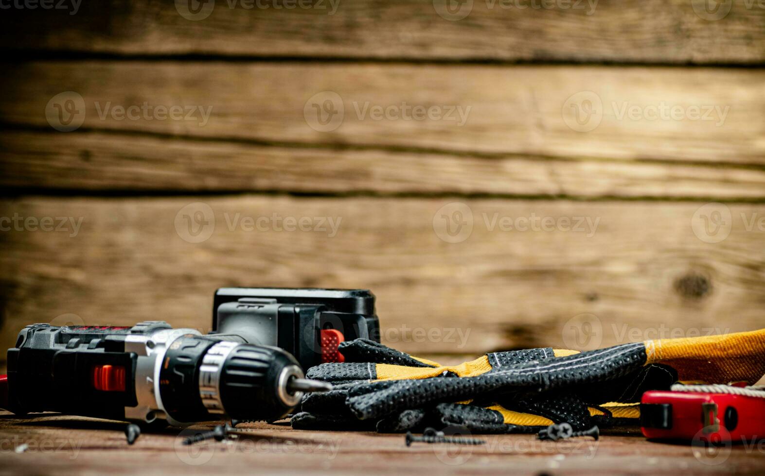 Working tool. Screwdriver with self-tapping screws on the table. photo