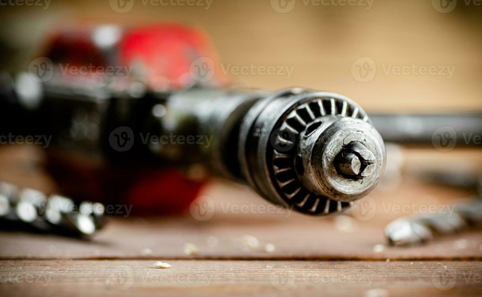 Drill with drills on the table. photo