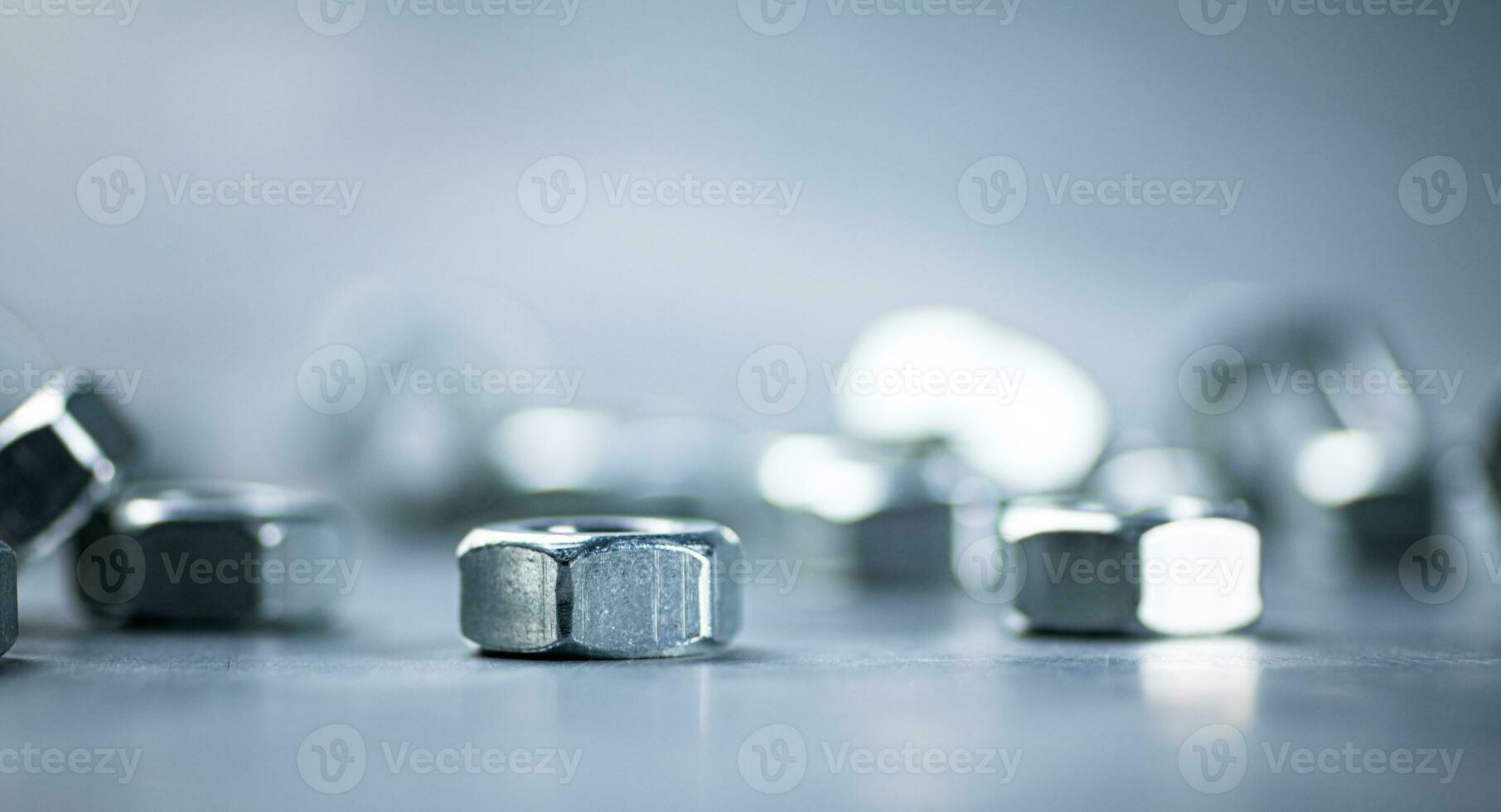 Working tool. Metal nuts on the table. photo
