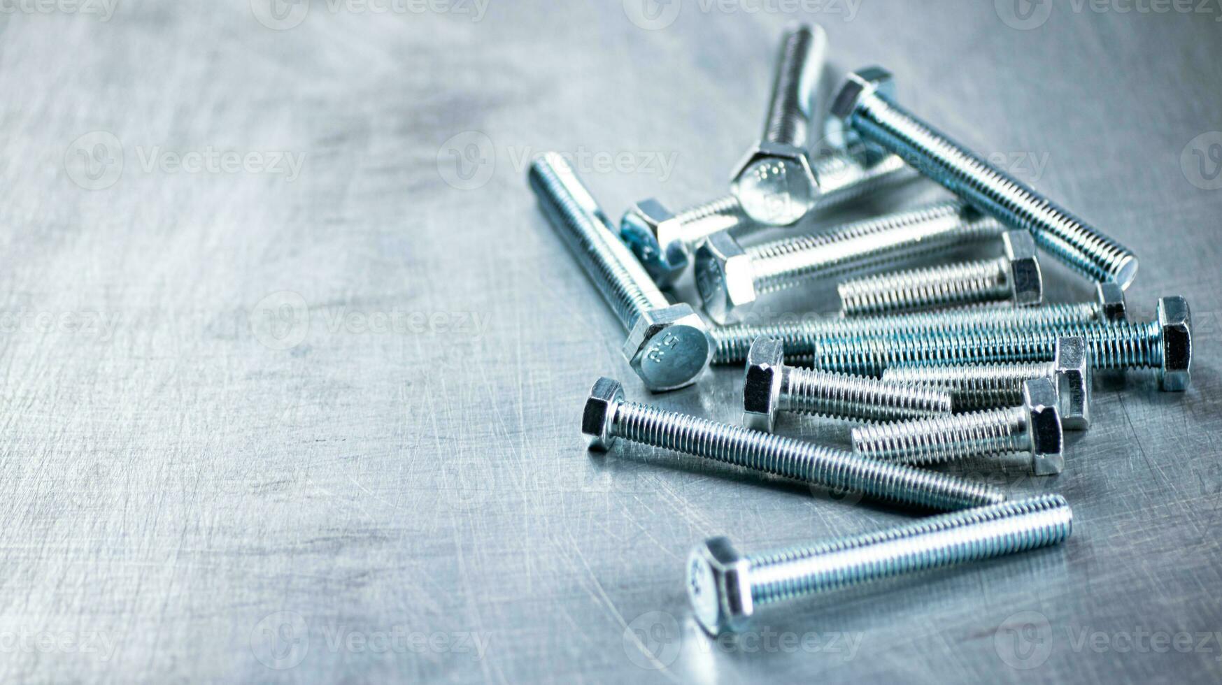 Working tool. Bolts on a gray background. photo