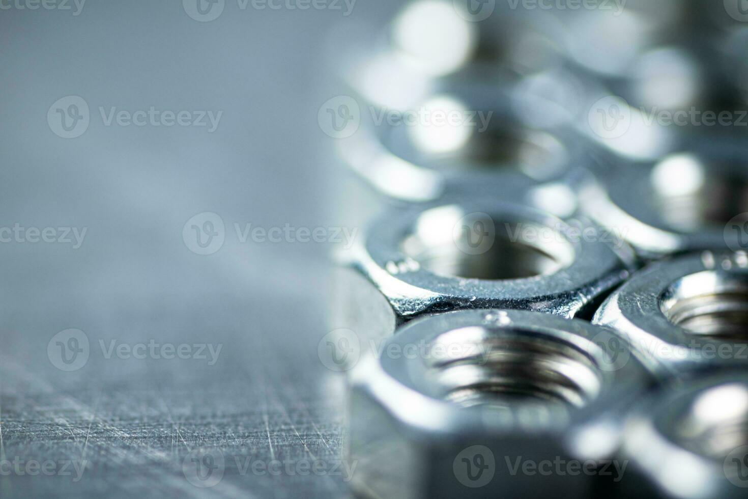 Working tool. Metal nuts on the table. photo