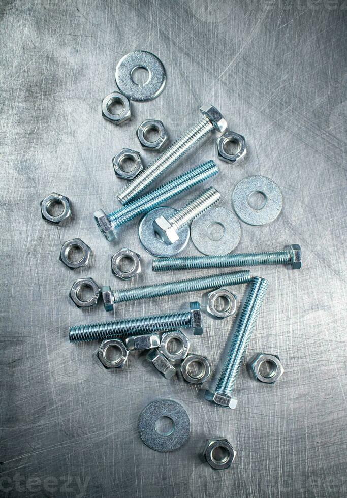 Nuts and bolts on the table. photo
