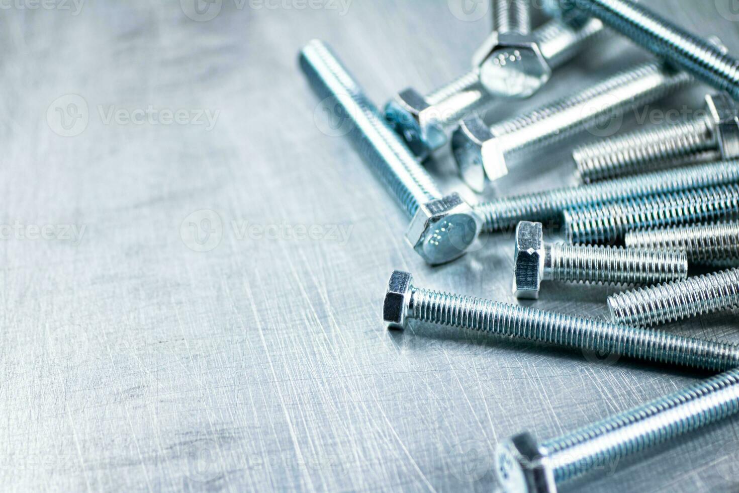 Working tool. Bolts on a gray background. photo