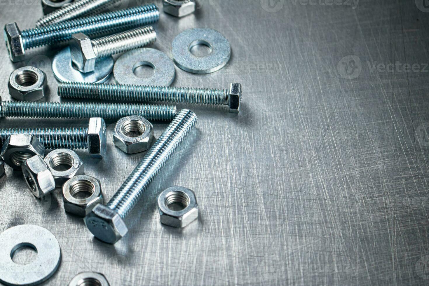 Working tool. Nuts and bolts on the table. photo