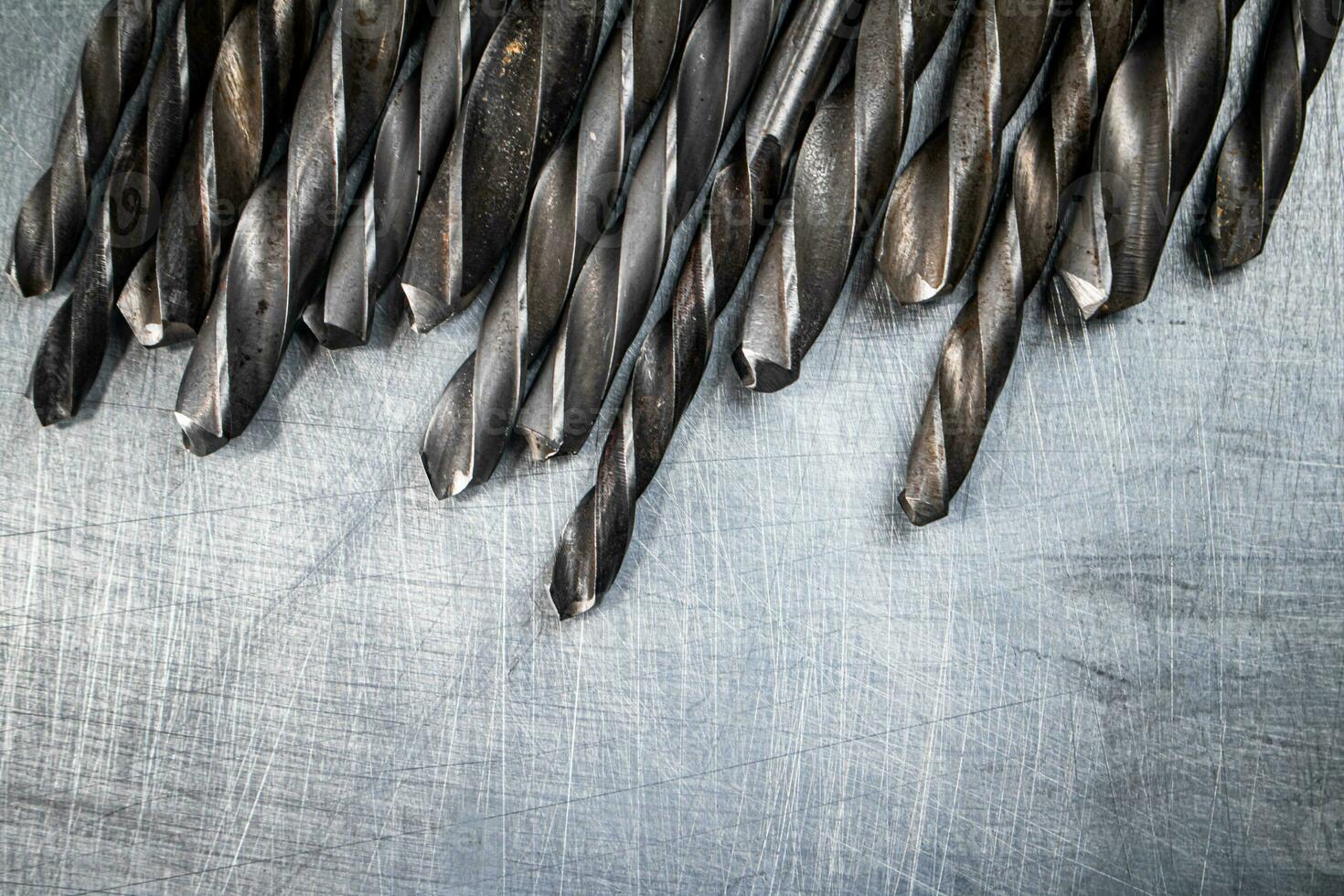 A bunch of drilled on the table. photo