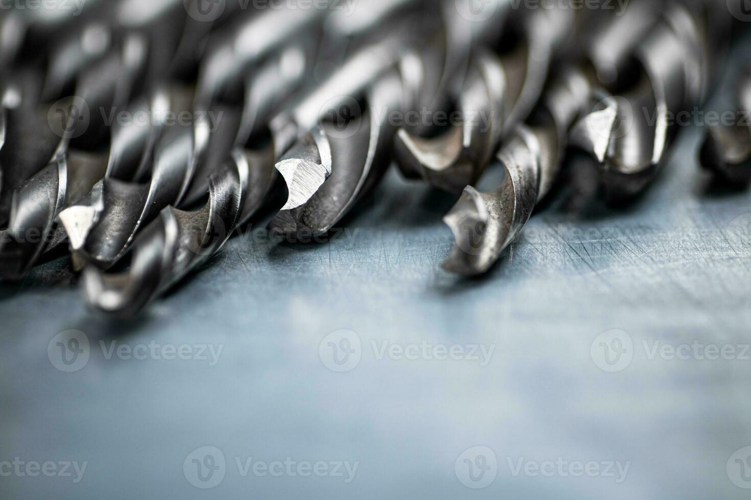 A bunch of drilled on the table. photo