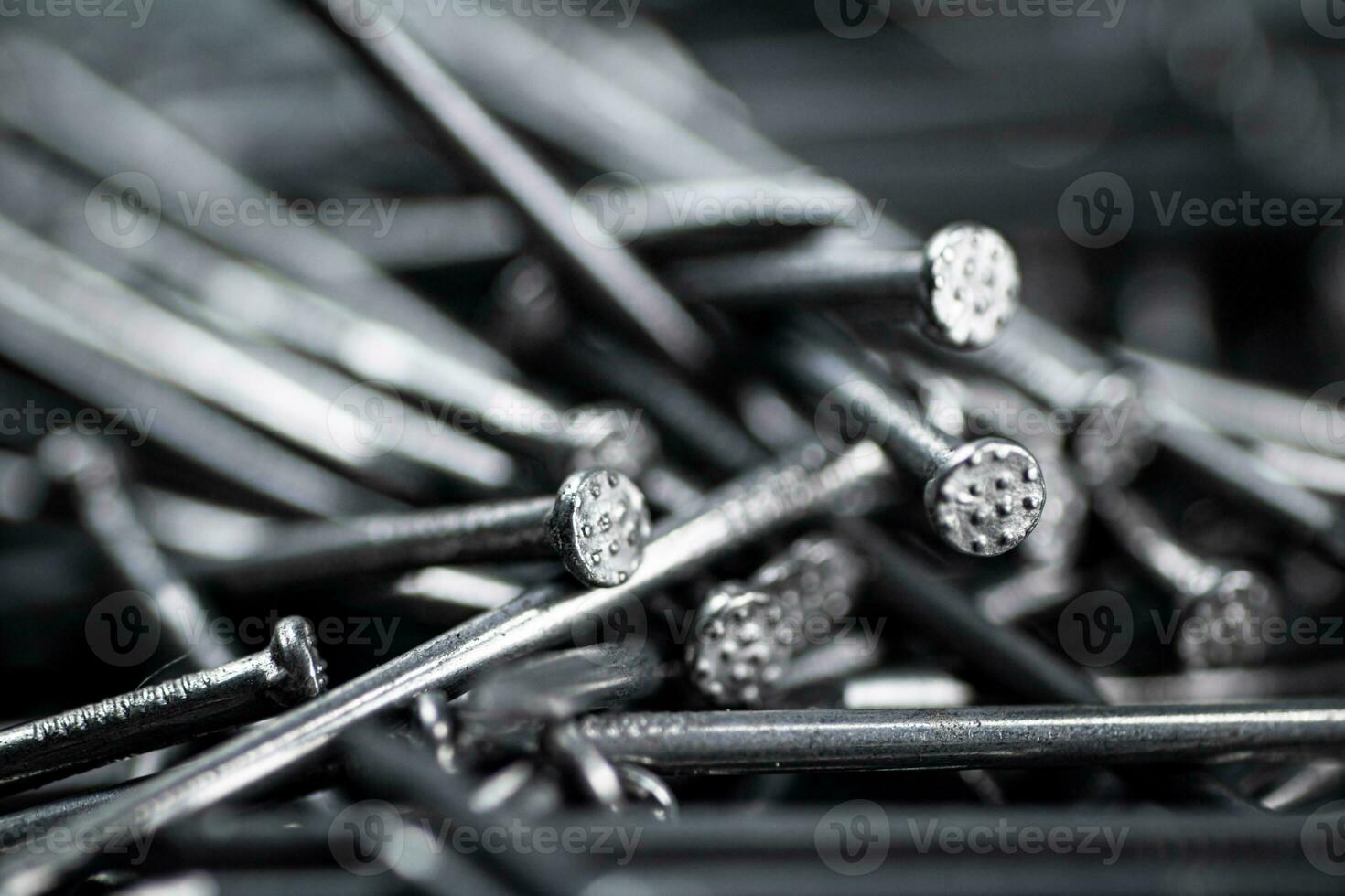 A bunch of nails on the table. photo