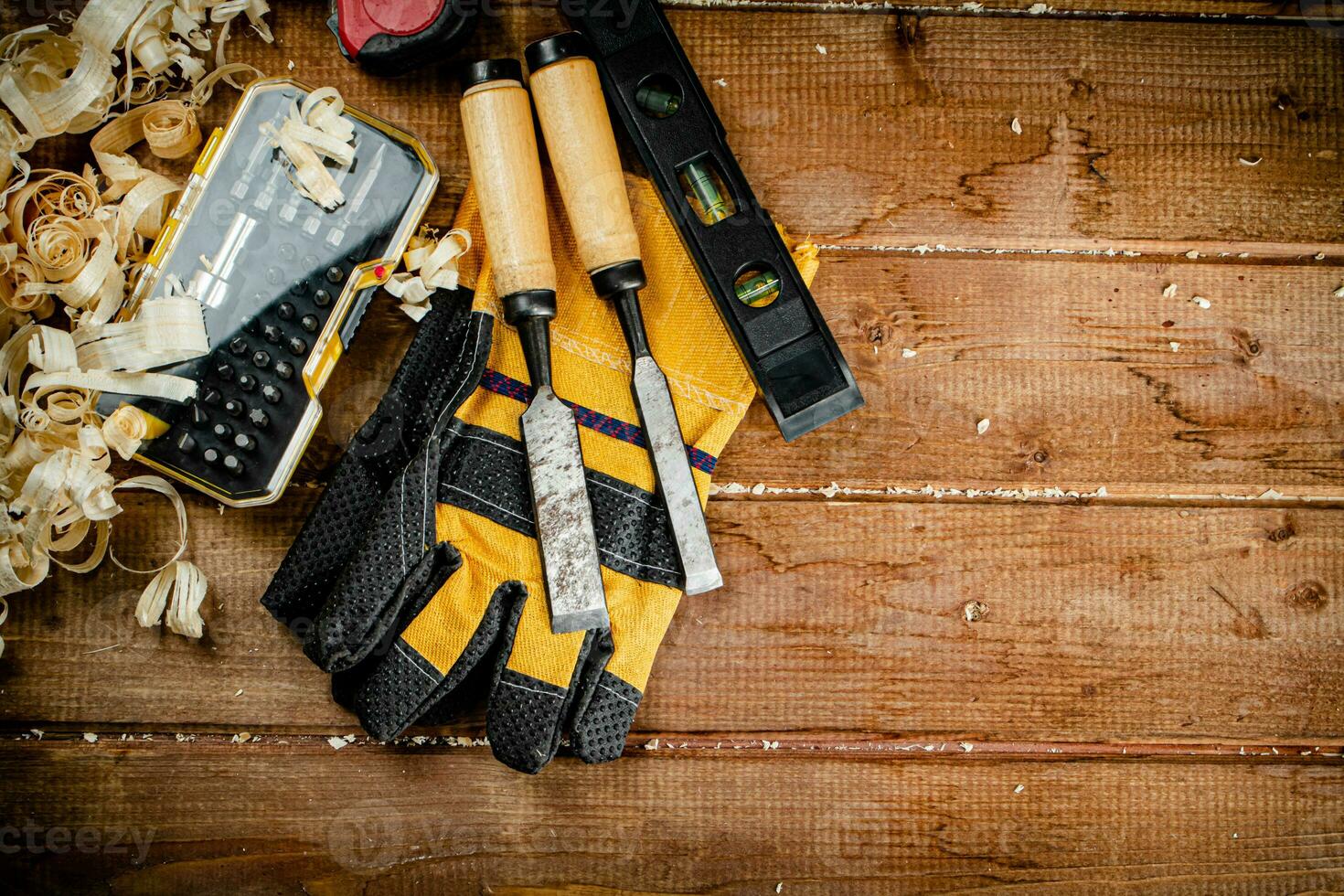 Chisels with wooden sawdust on the table. photo