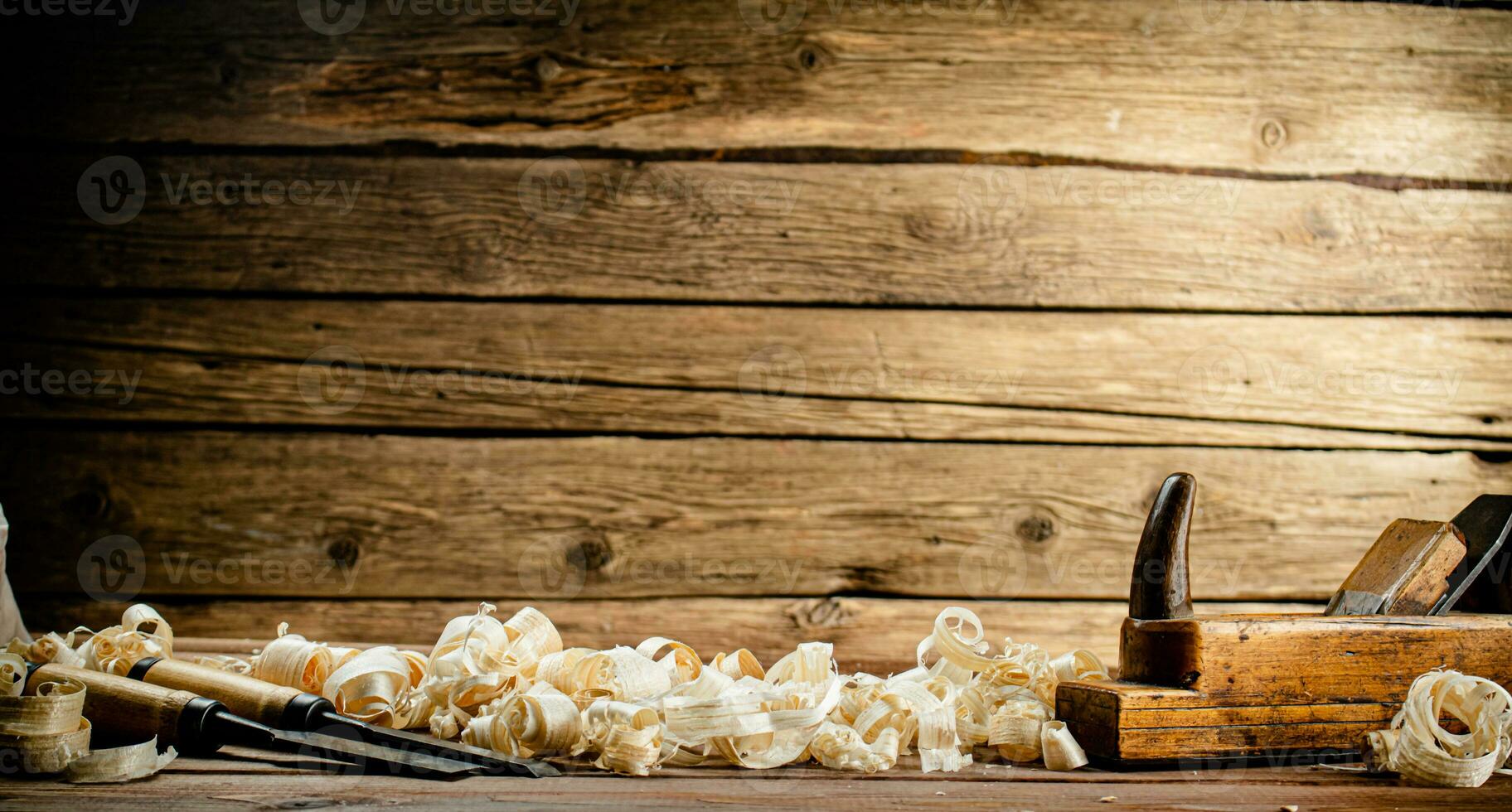 Working tool on wood on with shavings. photo