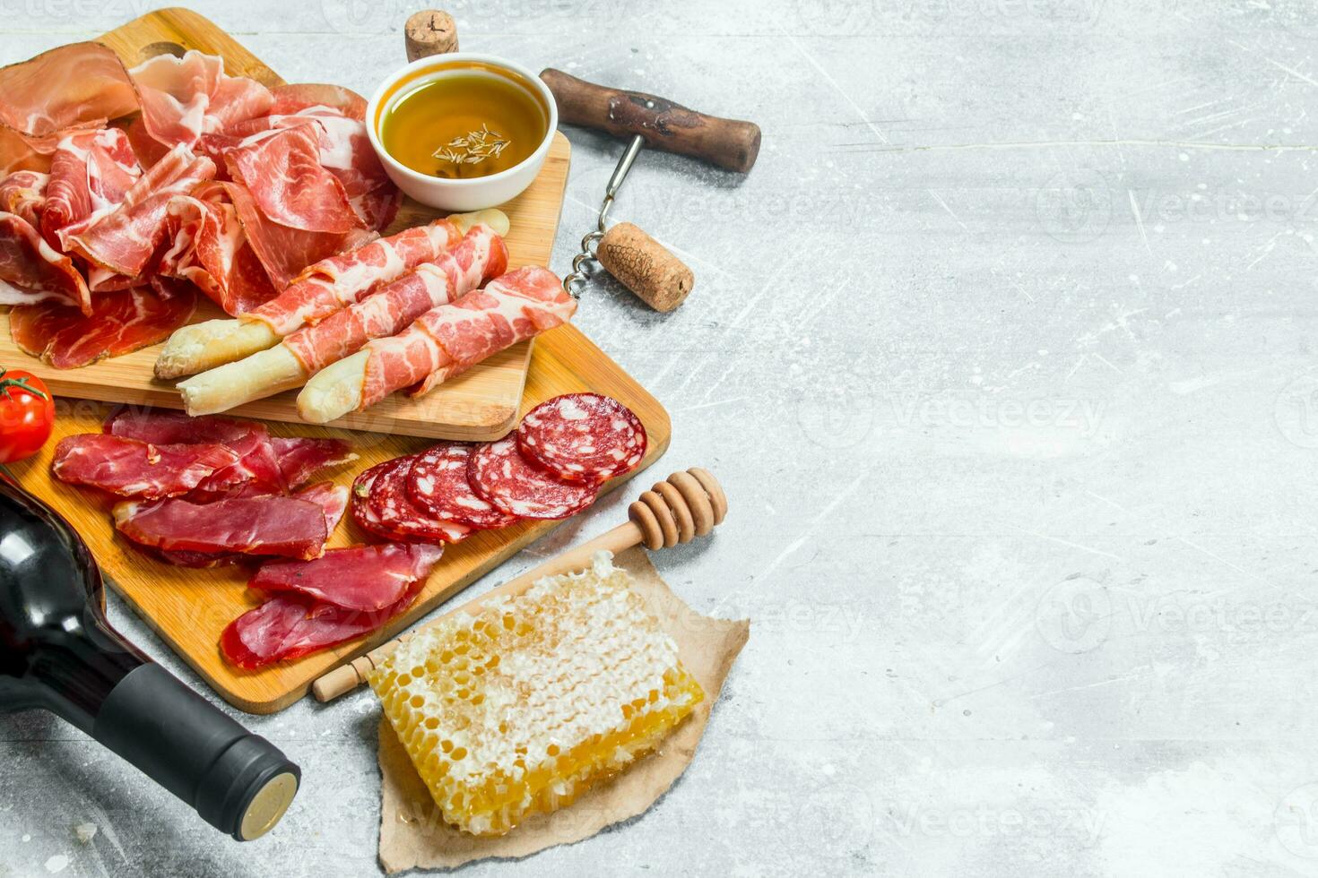 Antipasto background.Assortment of meat snacks with red wine. photo