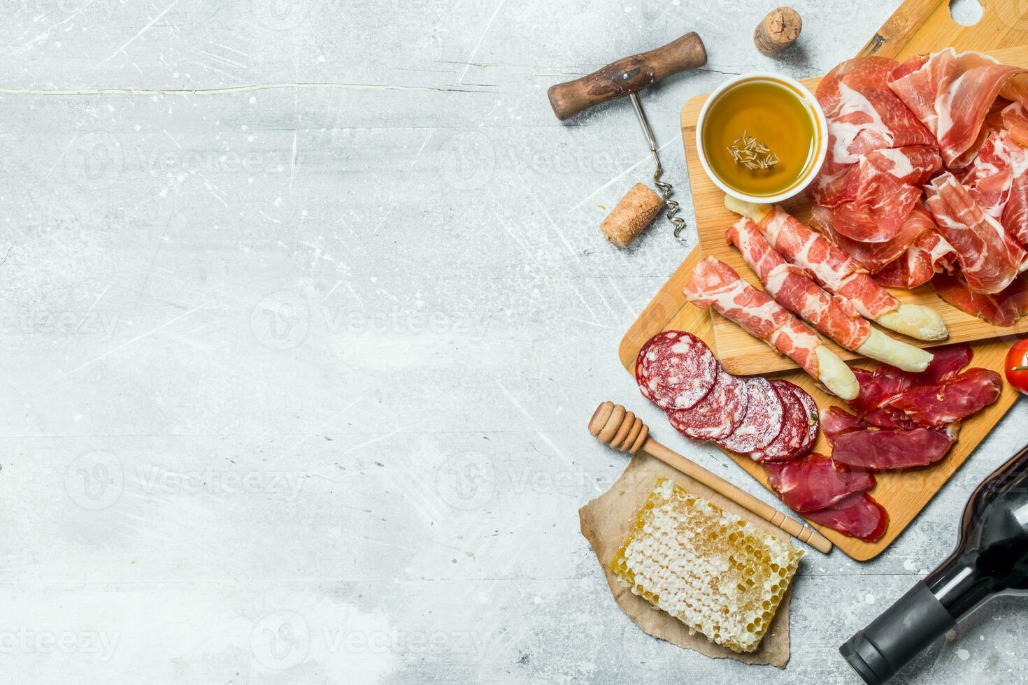 Antipasto background.Assortment of meat snacks with red wine. photo