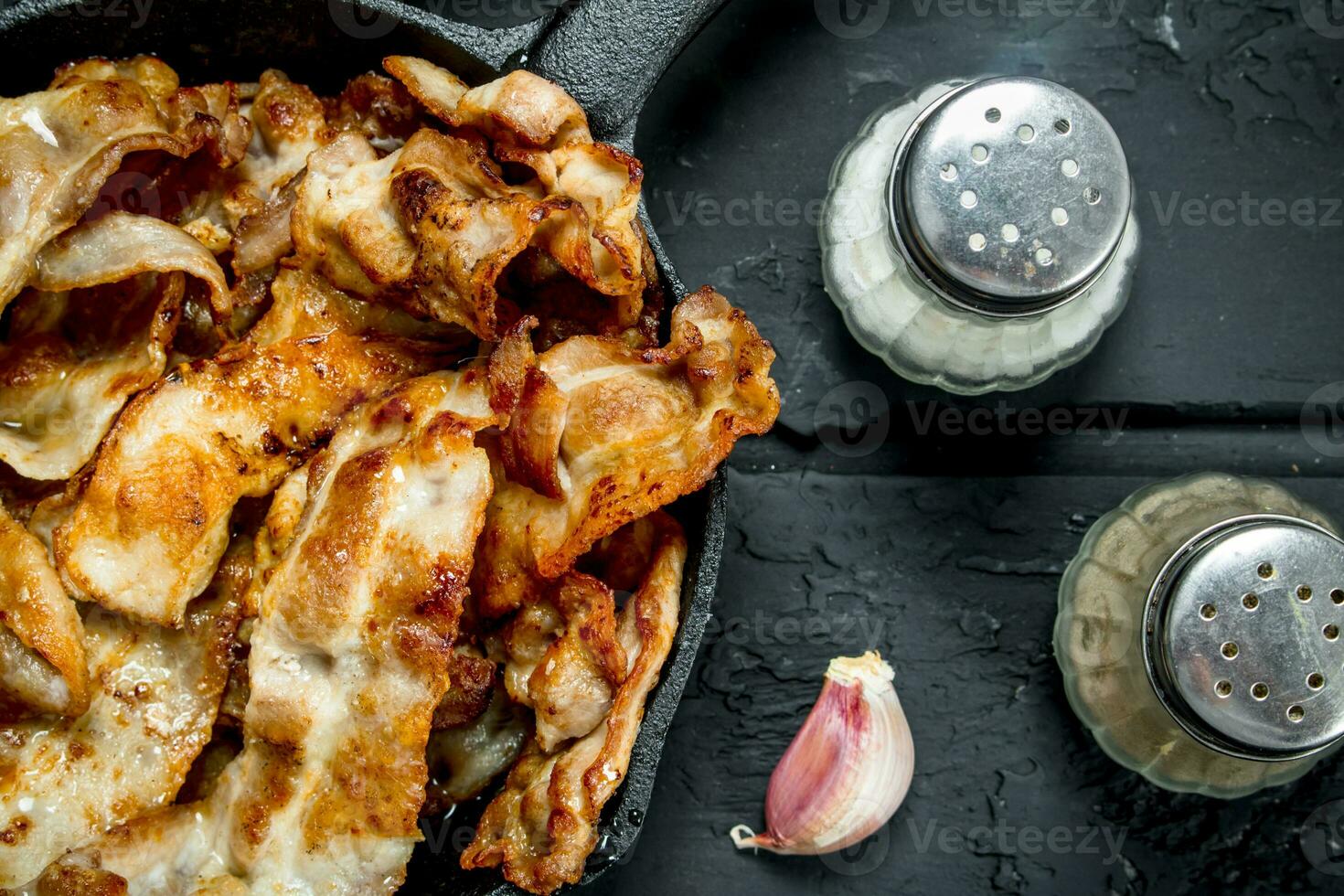 Fried bacon with spices. photo