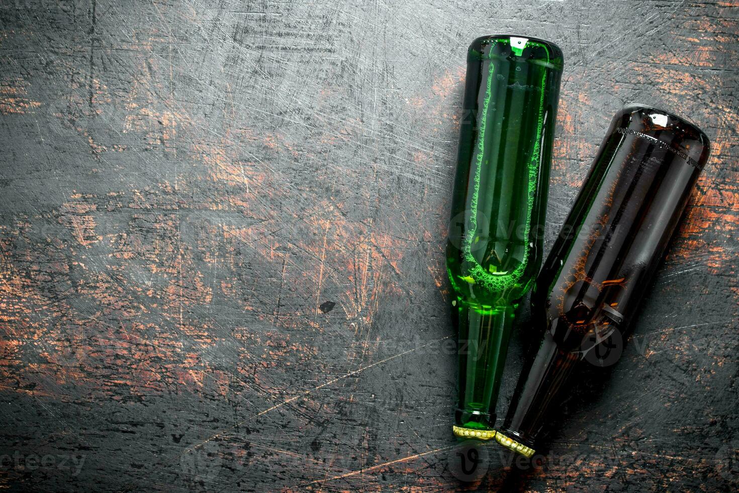 Two glass bottles of beer. photo