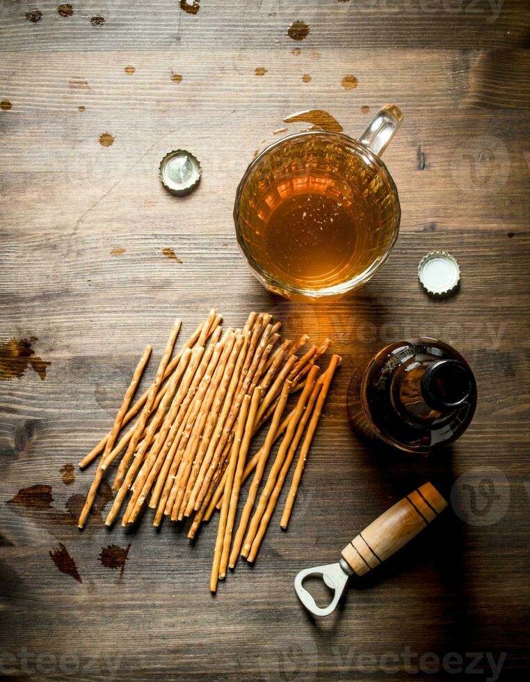 Beer in a glass mug with salt straws. photo