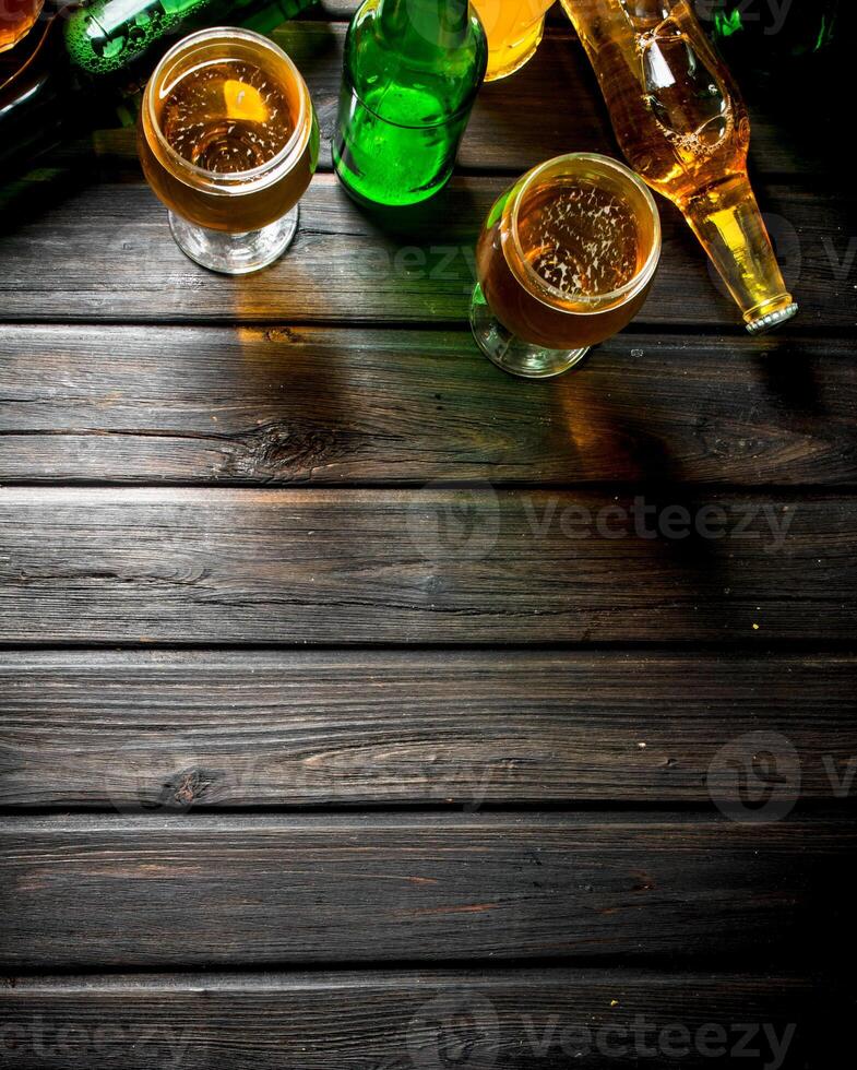Beer in bottles and glasses. photo