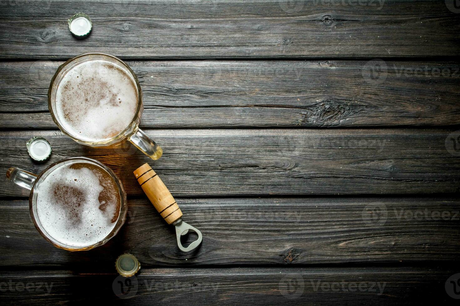 Beer mugs and opener. photo