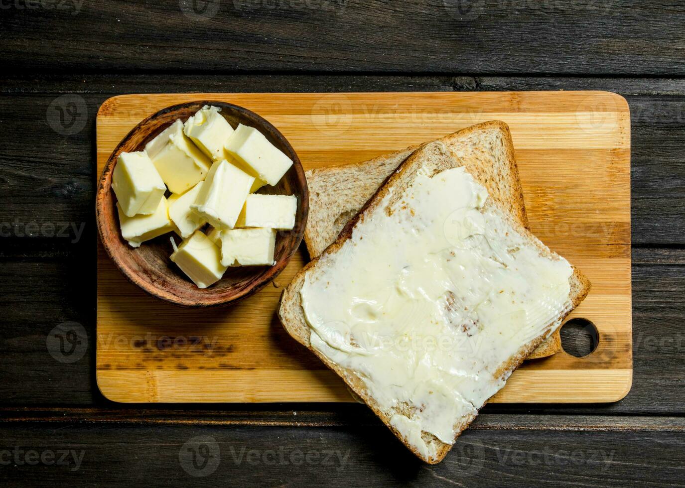 Toasted bread and butter on the Board. photo