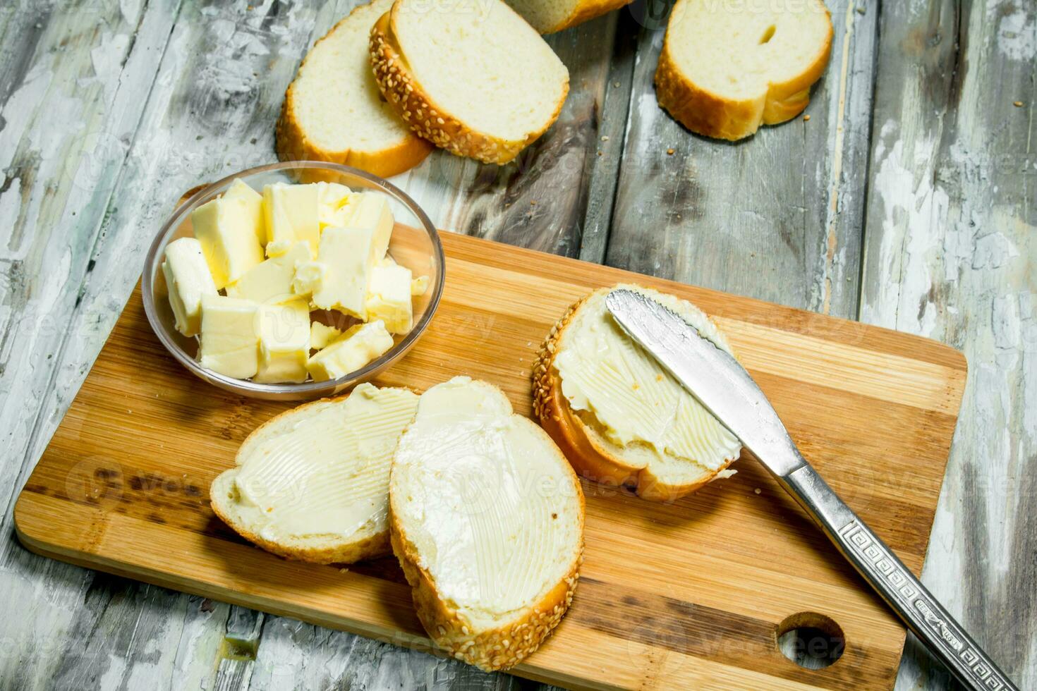 Fresh bread and butter on the Board . photo