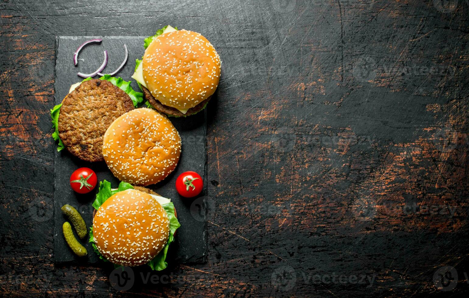 Burgers with beef,tomatoes and cucumbers. photo