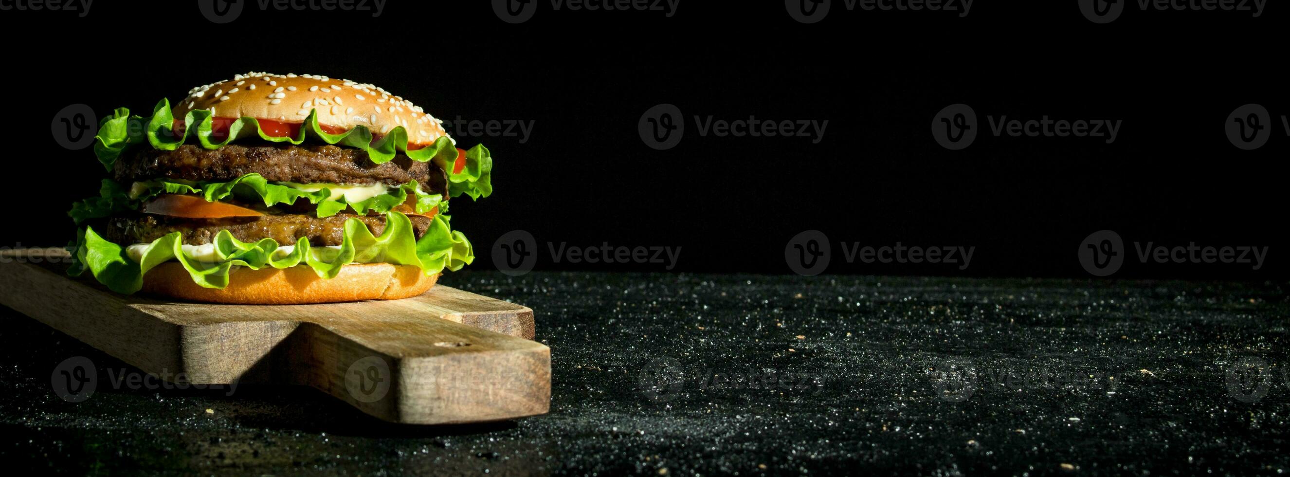 Burger with beef and vegetables. photo