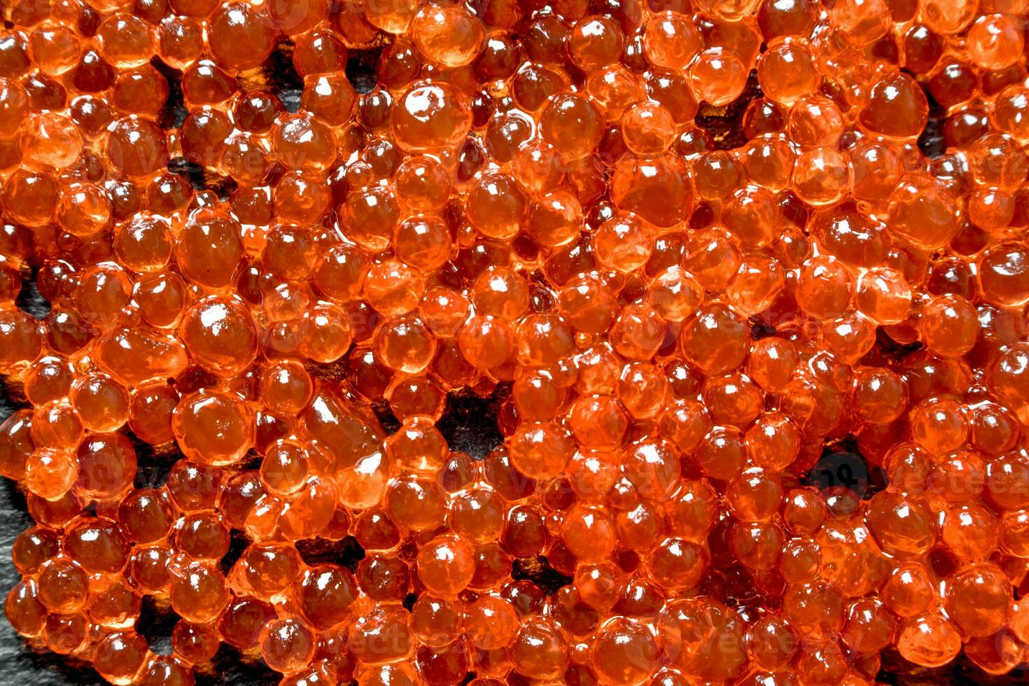 Grains of red caviar. Texture photo