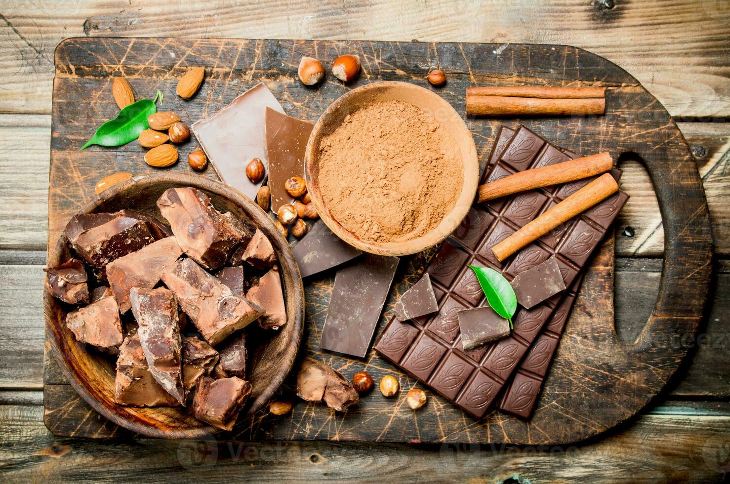 Chocolate background. Chocolate with cocoa powder and cinnamon. photo